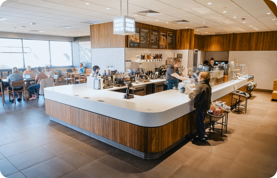 Customer waiting for order at Starbucks counter in the MAC