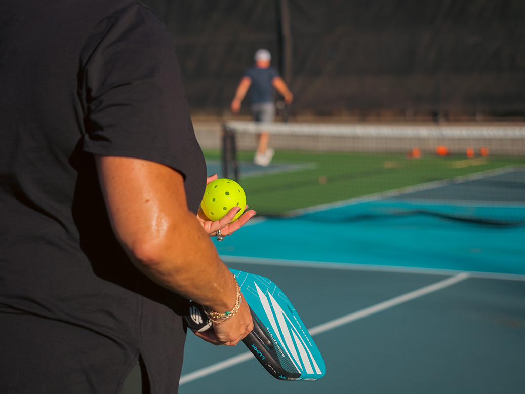 Getting ready to serve in a game of pickleball