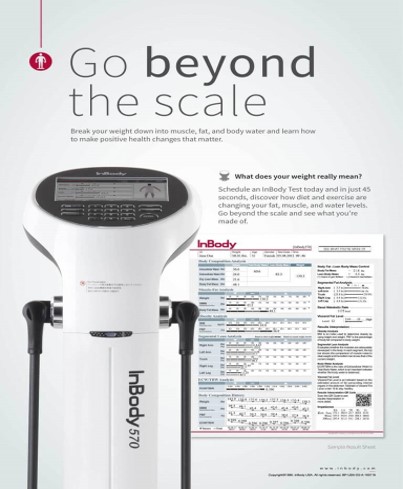 Woman working out with kettle bell in weight lifting facility 